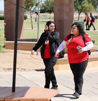 Female student walking on campus.